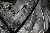 Expanded stainless steel mesh sheets laid out for architectural safety applications.