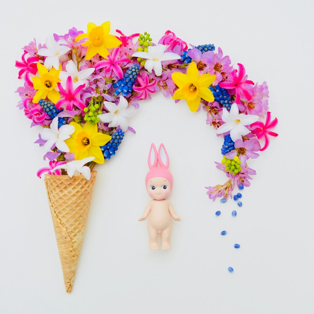 yellow, pink, and blue flowers on cone wall decor