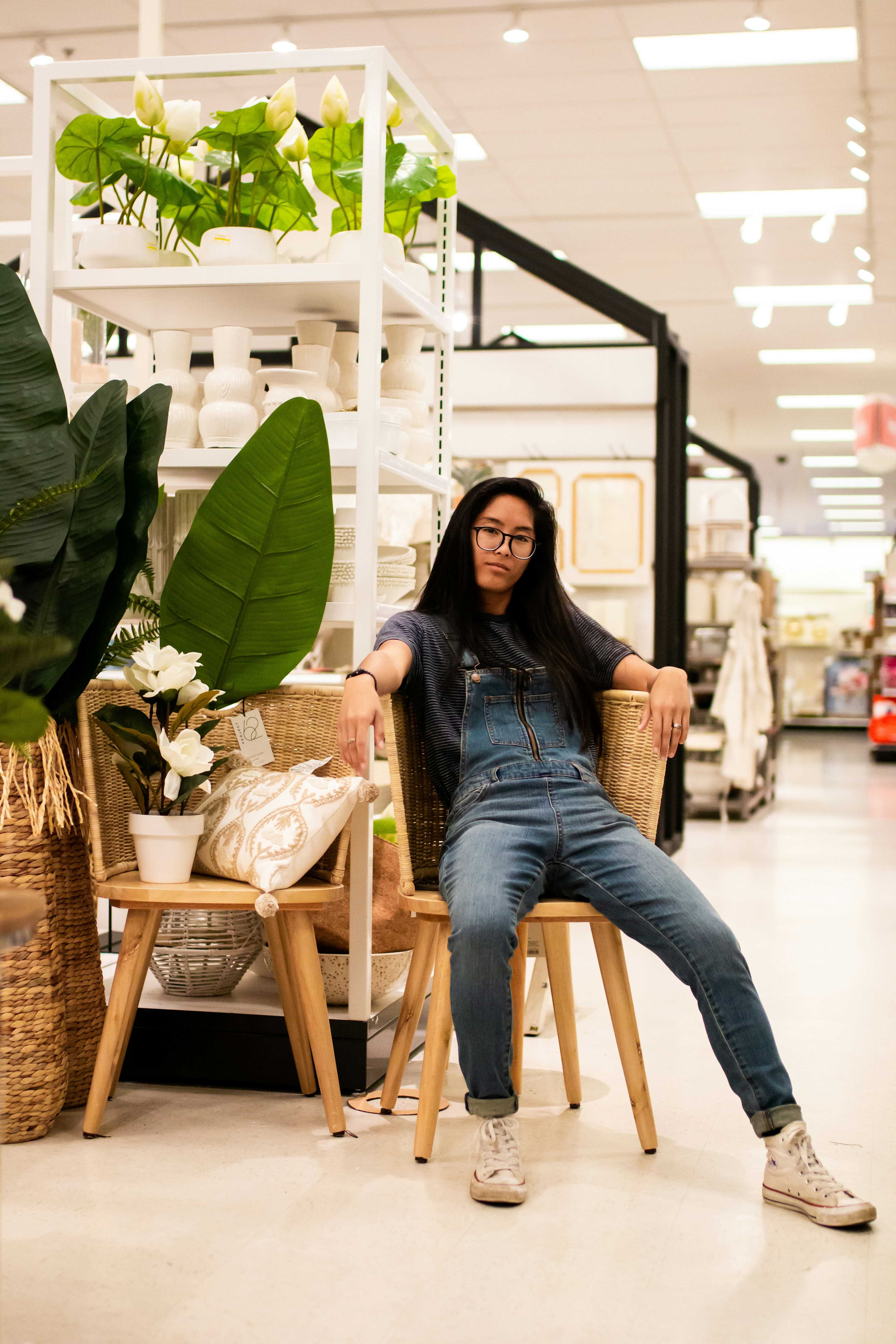 woman sitting on brown chair