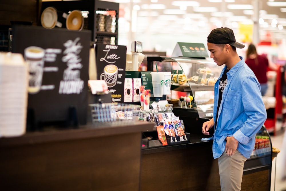 man standing in front cashier