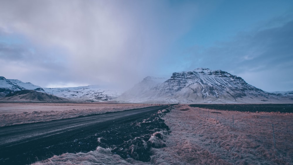 empty road surrounded by mountains