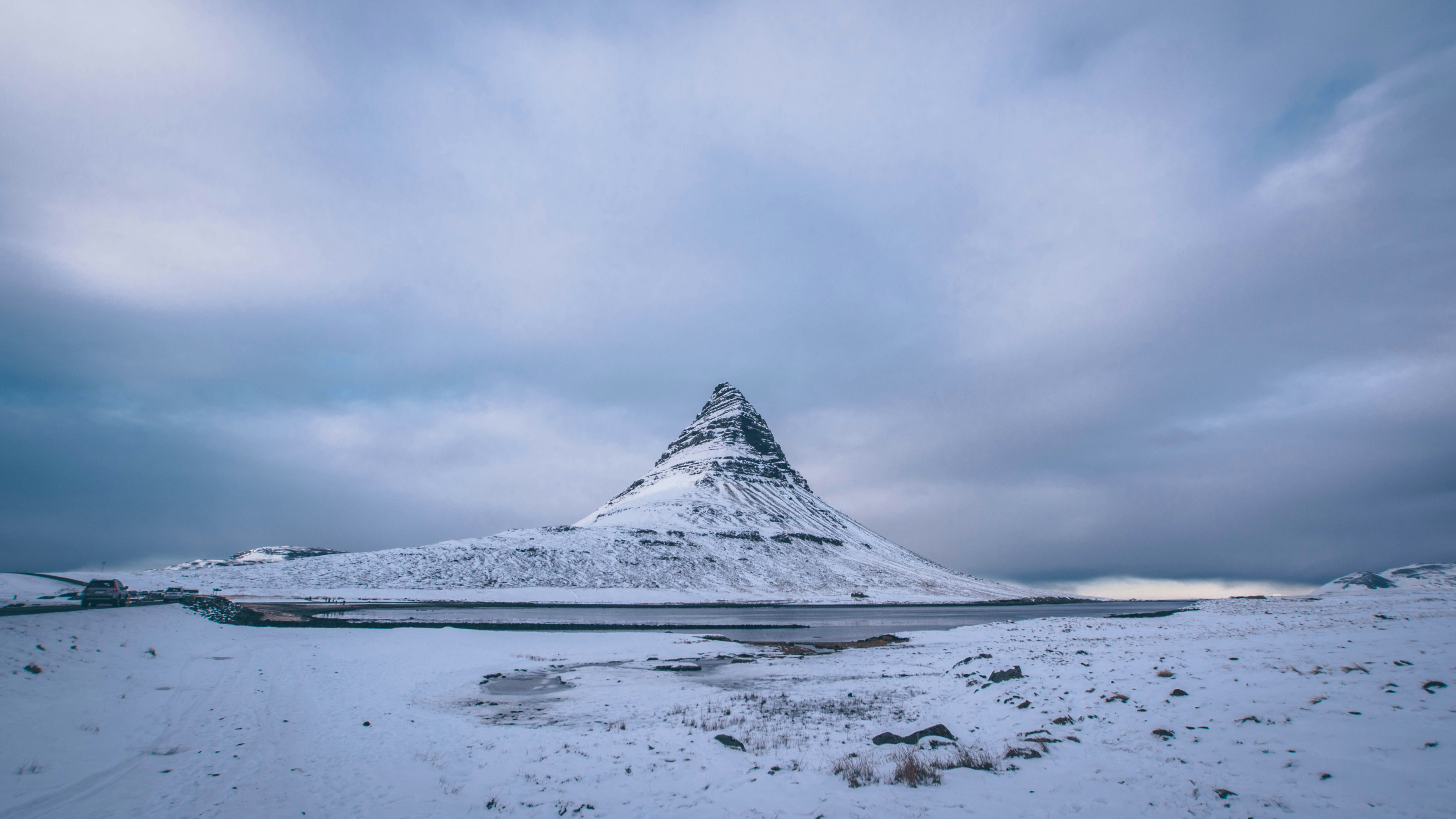 snow capped mountain under cloudy sky during daytime