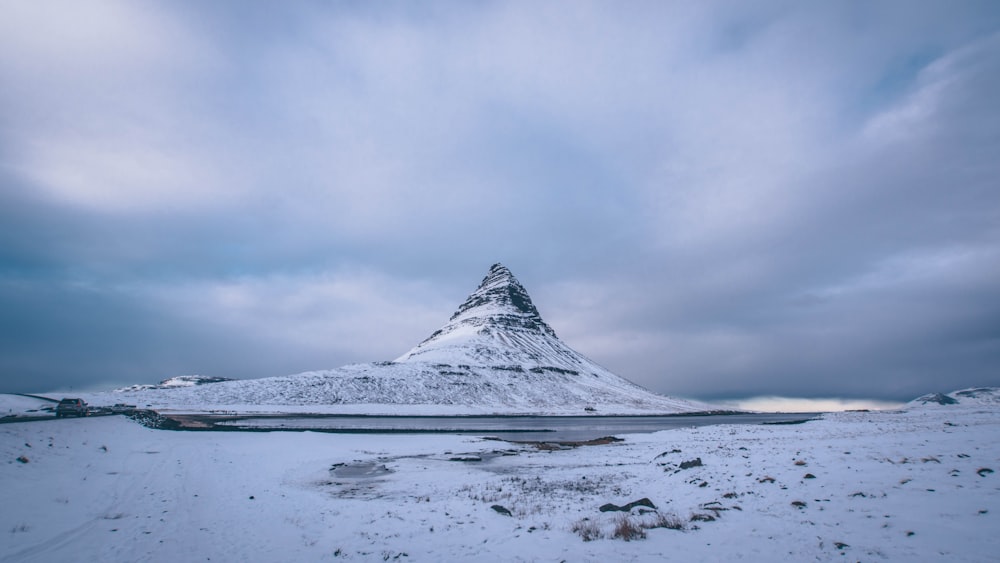 snow capped mountain under cloudy sky during daytime