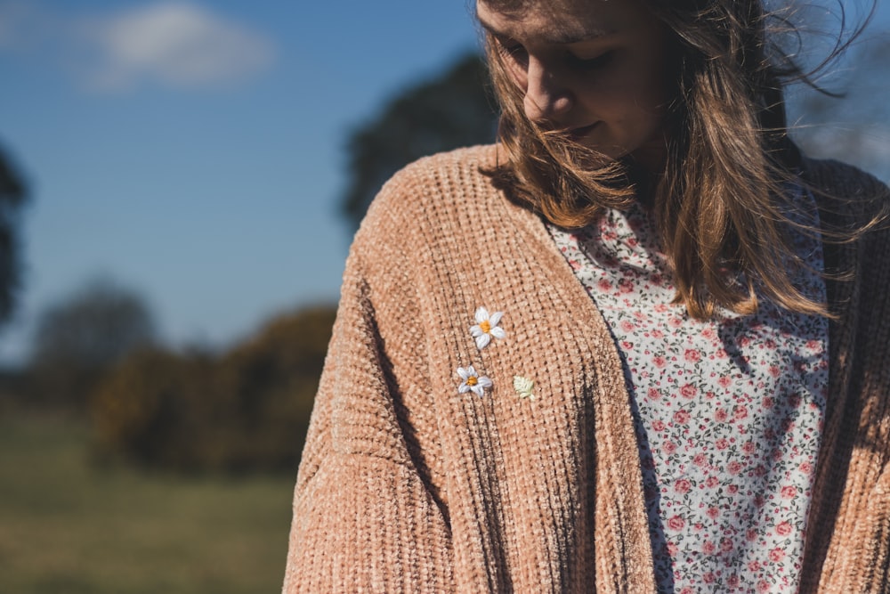 woman in brown cardigan