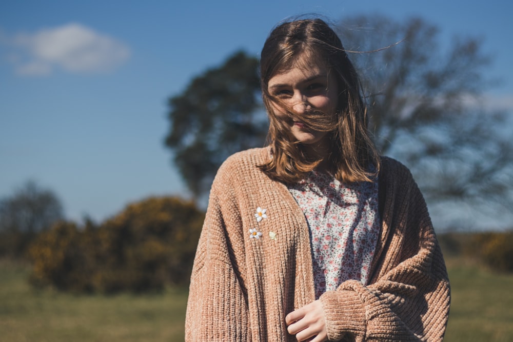 woman in brown floral knit cardigan