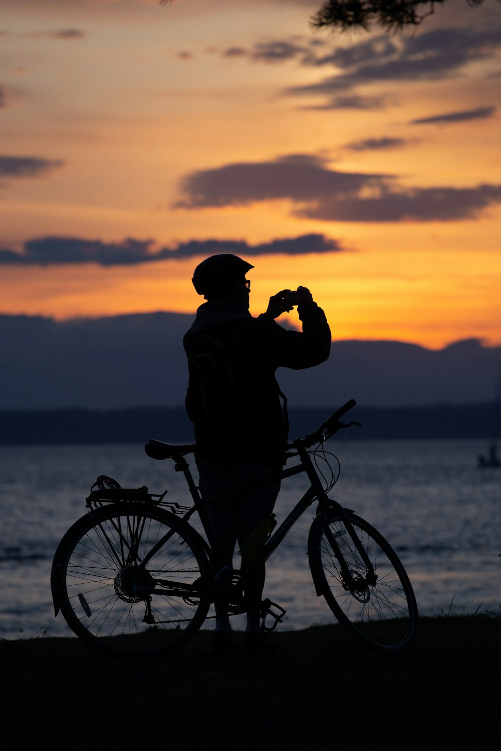 silhouette photography of man with bike