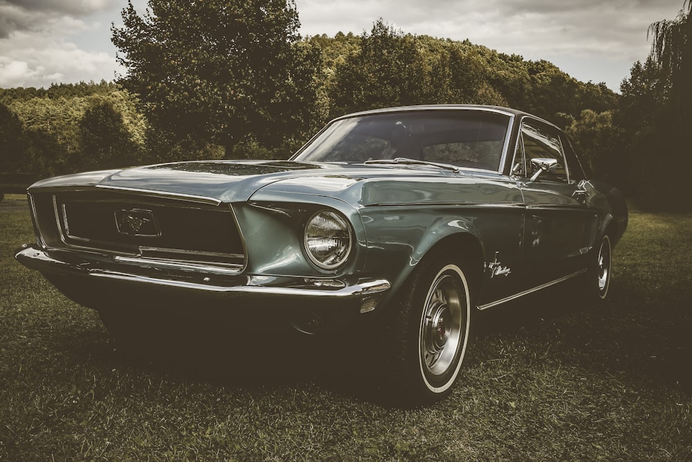 parked classic gray Ford Mustang during daytime
