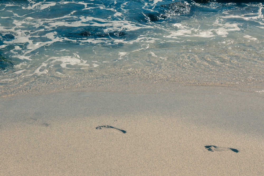 set of footprints at the beach