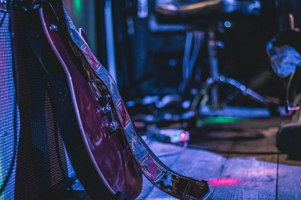 black electric guitar on stange