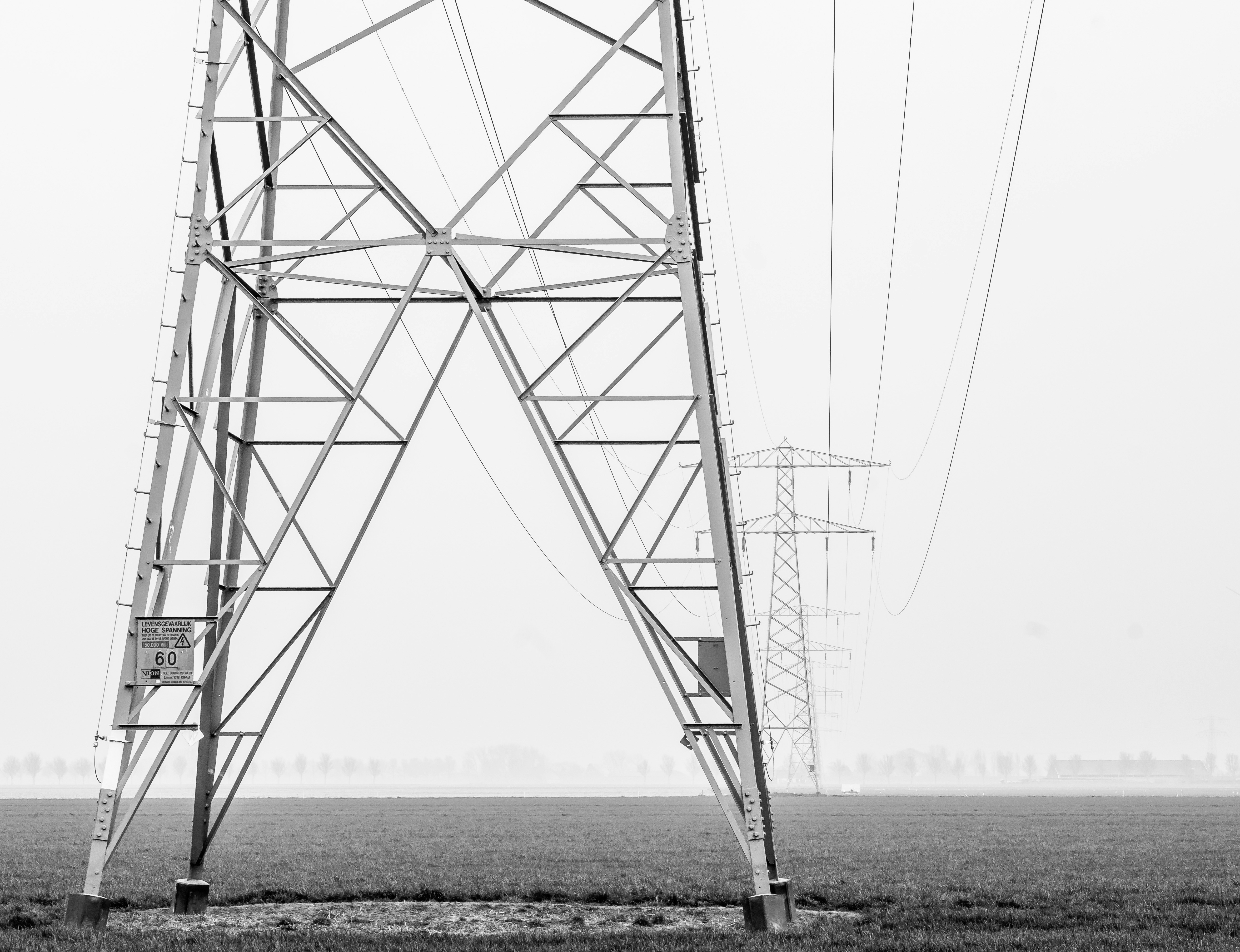 grayscale photography of transformer tower