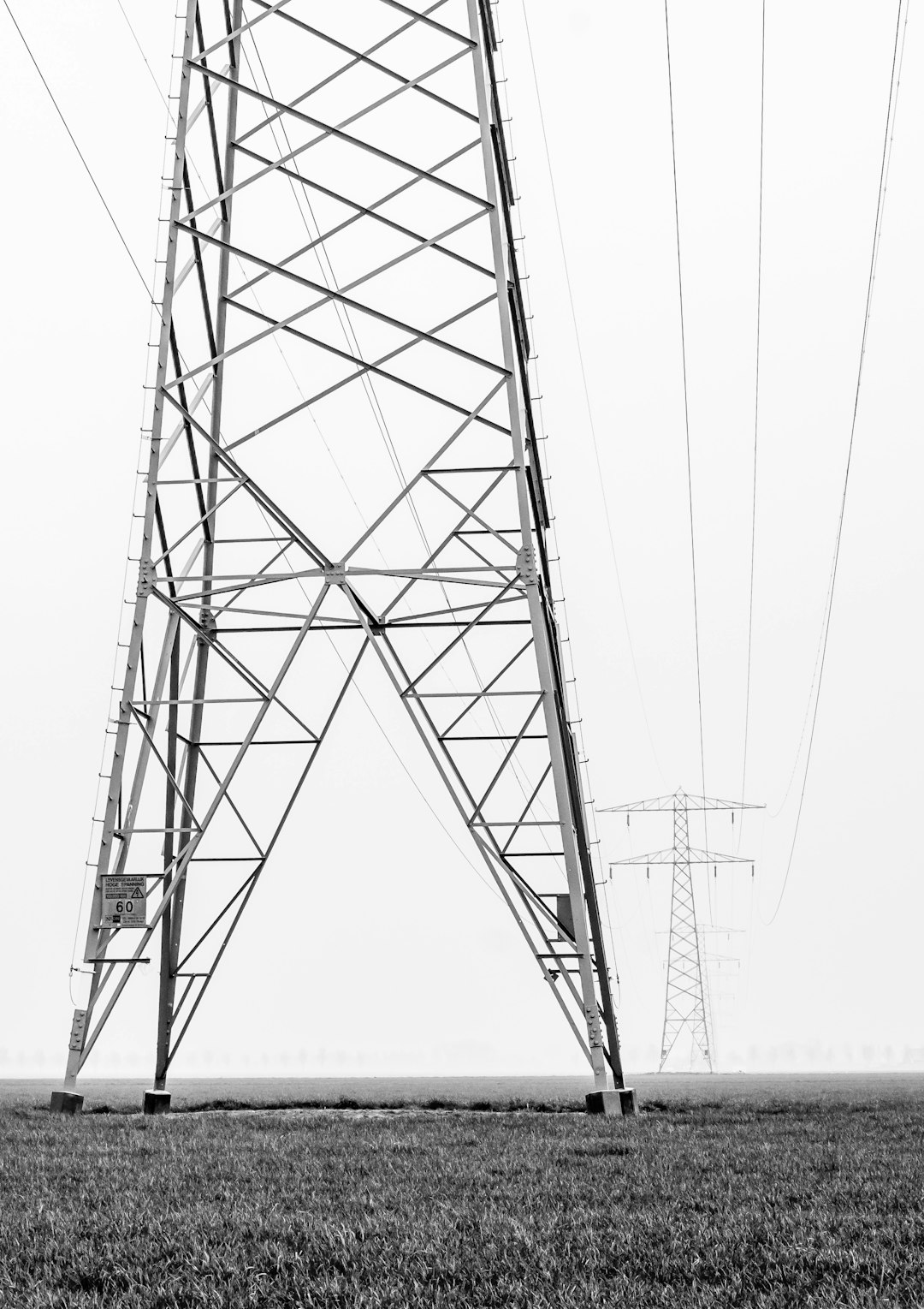 gray transmission towers during daytime