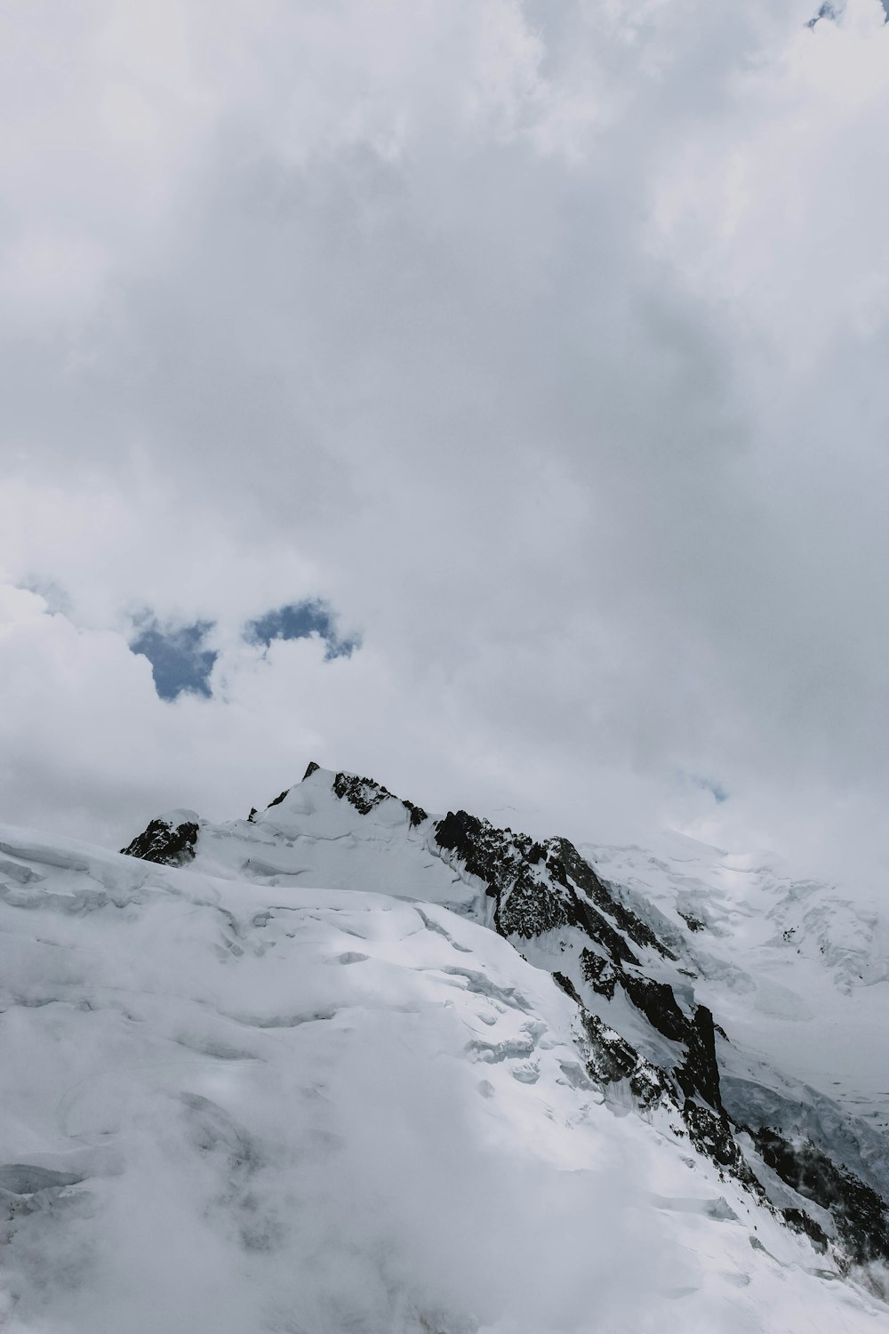 white snow on mountain during daytime