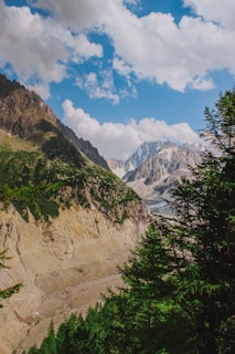 An awe-inspiring mountain landscape with lush greenery and clear blue skies.