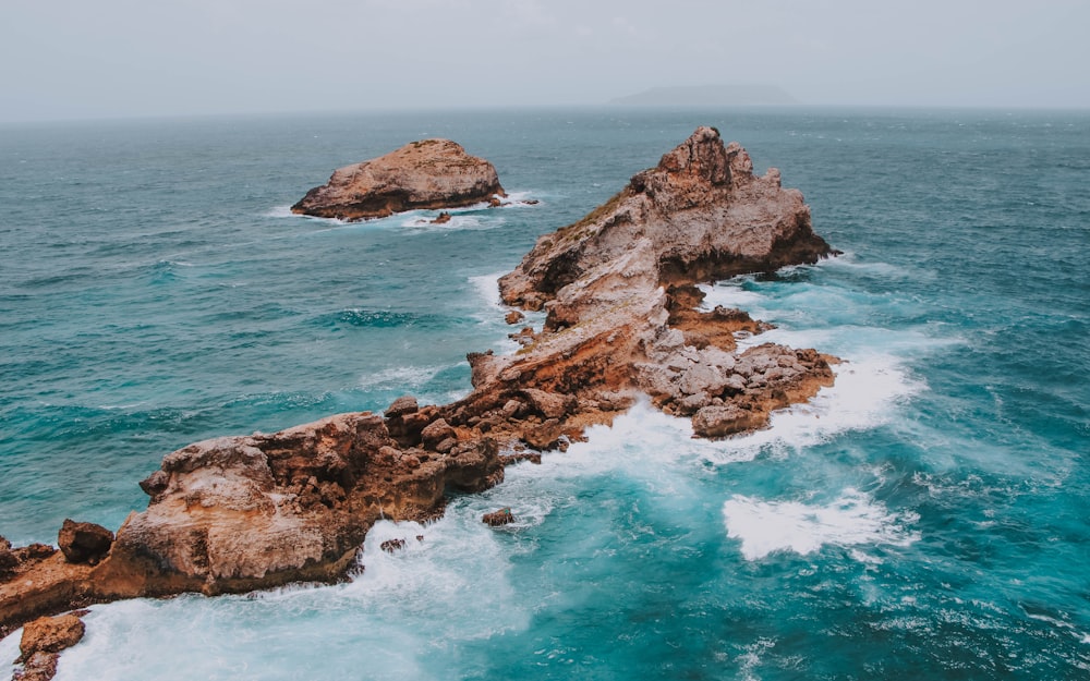 rocks on body of water