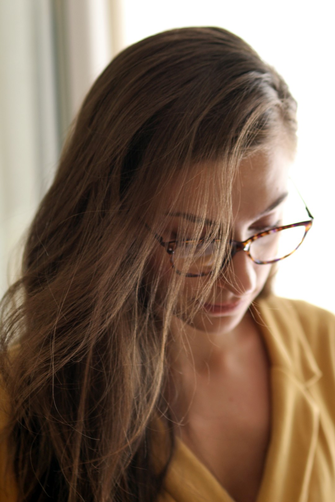 woman wearing brown framed eyeglasses