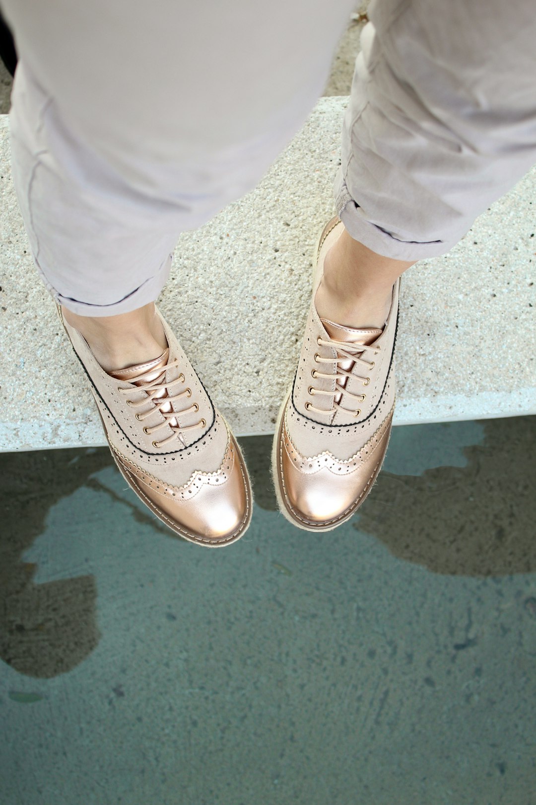 man in gold leather wingtip shoes