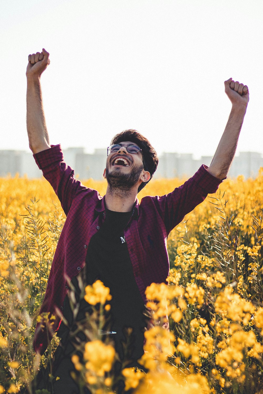 man raising his two hands