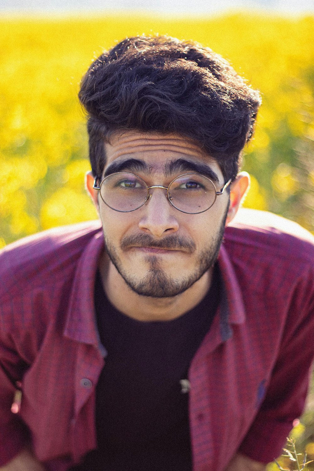 man wearing red collared top