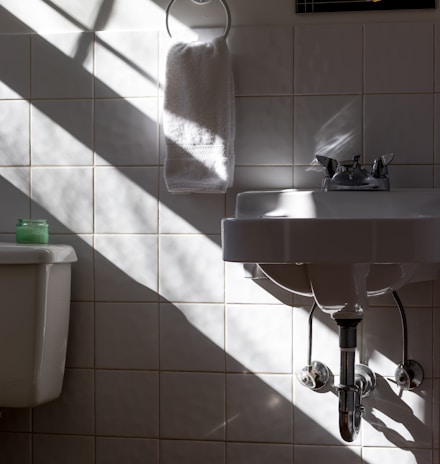 hanged towel beside sink