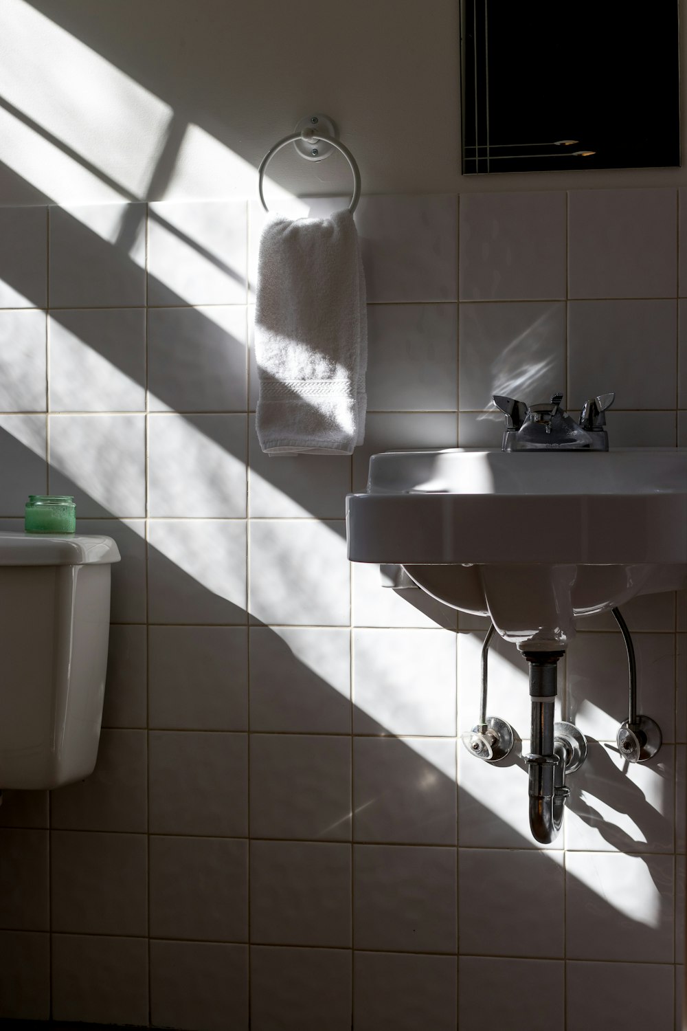 hanged towel beside sink