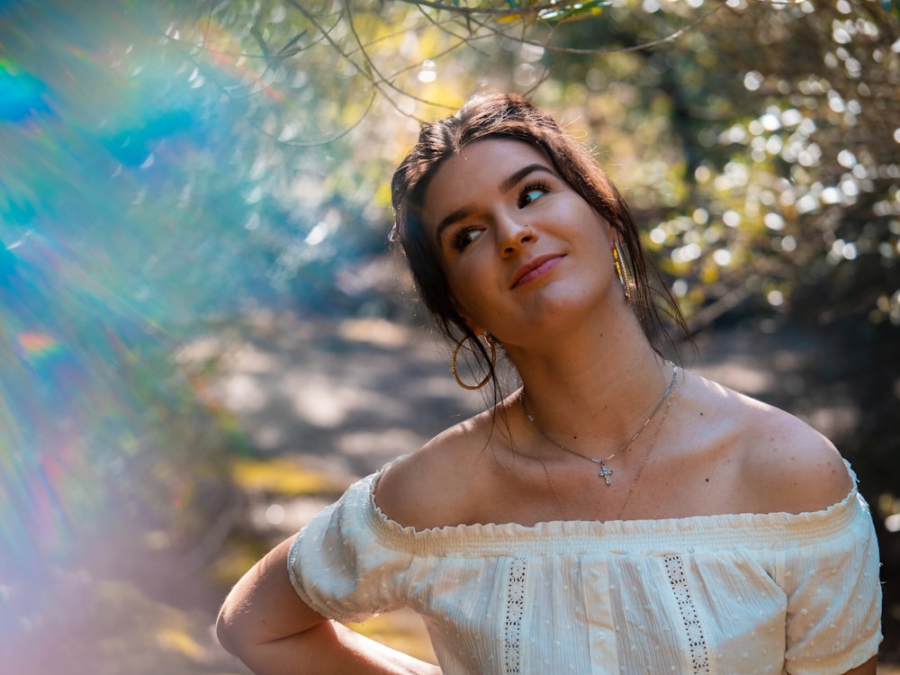 selective focus photography of woman under tree