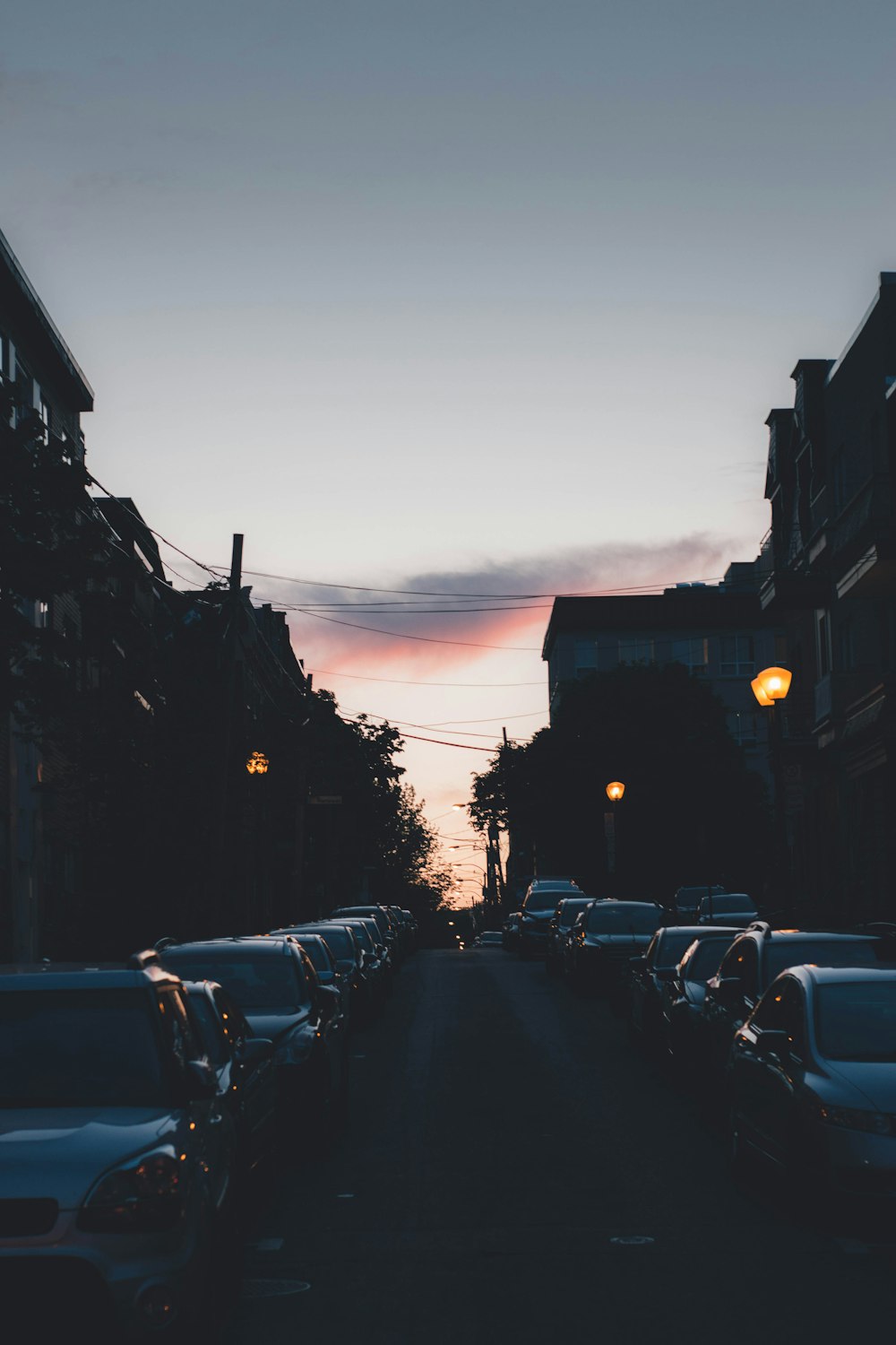 a street with cars parked on both sides of it