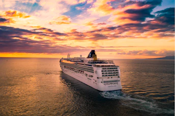 white cruise ship under cloudy sky