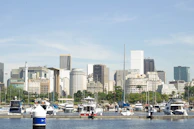 A panoramic view of the exotic fleet lined up against a dark, blurred Miami cityscape.