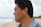 man looking at the beach water