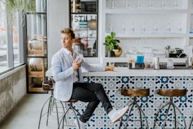 man sitting on stool