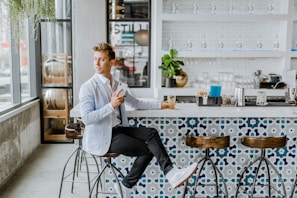 man sitting on stool