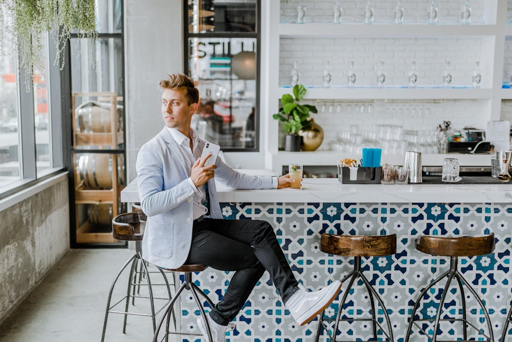 man sitting on stool