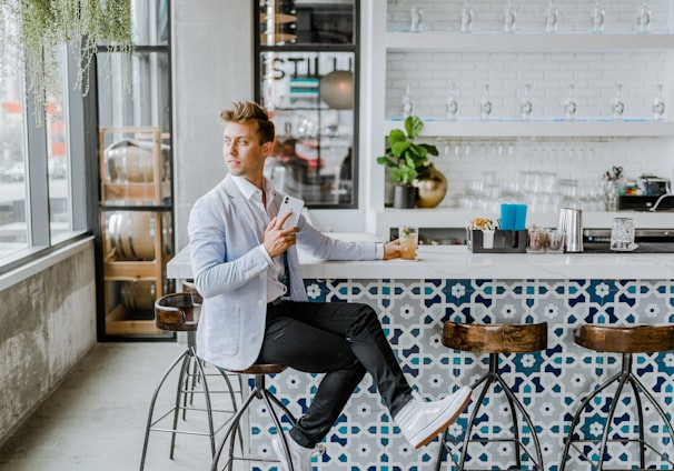 man sitting on stool