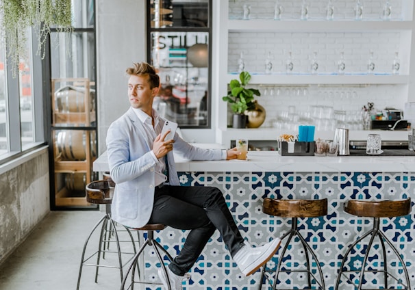 man sitting on stool