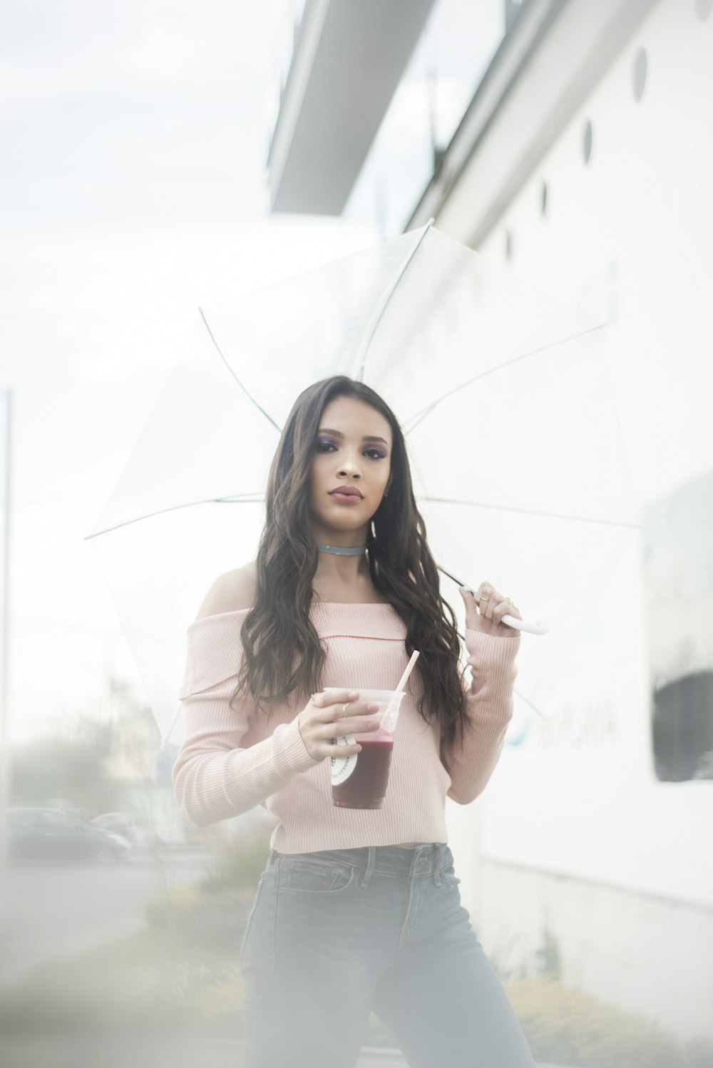 woman wearing pink off-shoulder long-sleeved shirt