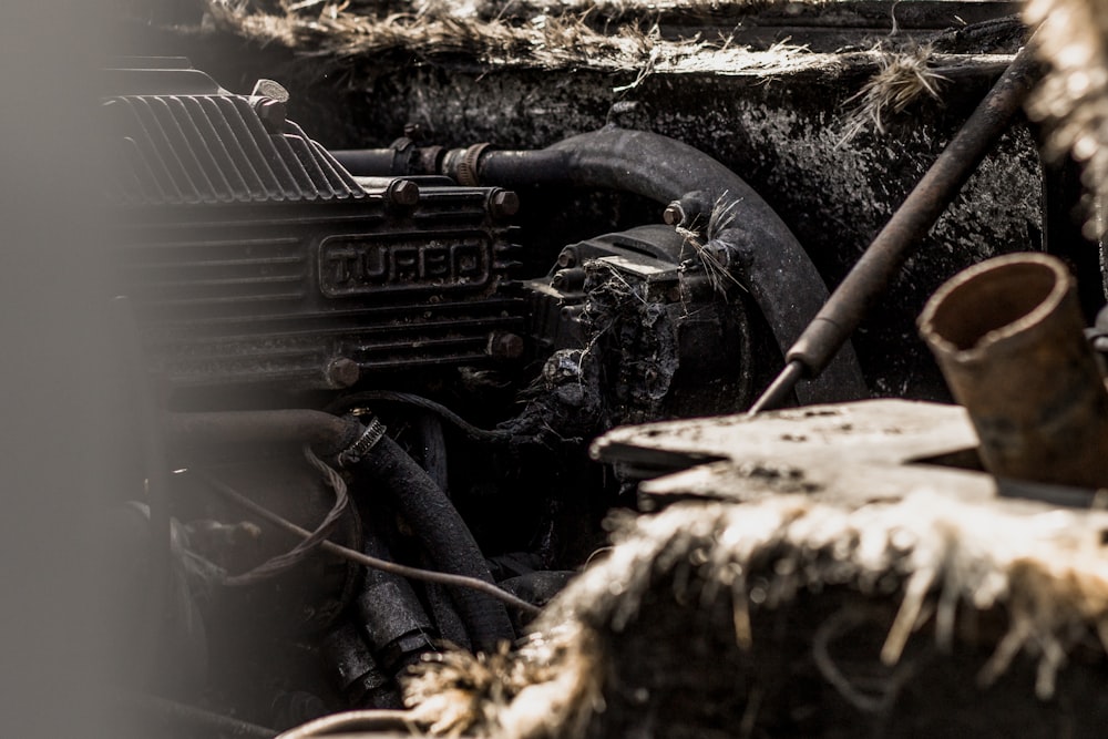 a close up of a machine with a lot of dirt on it