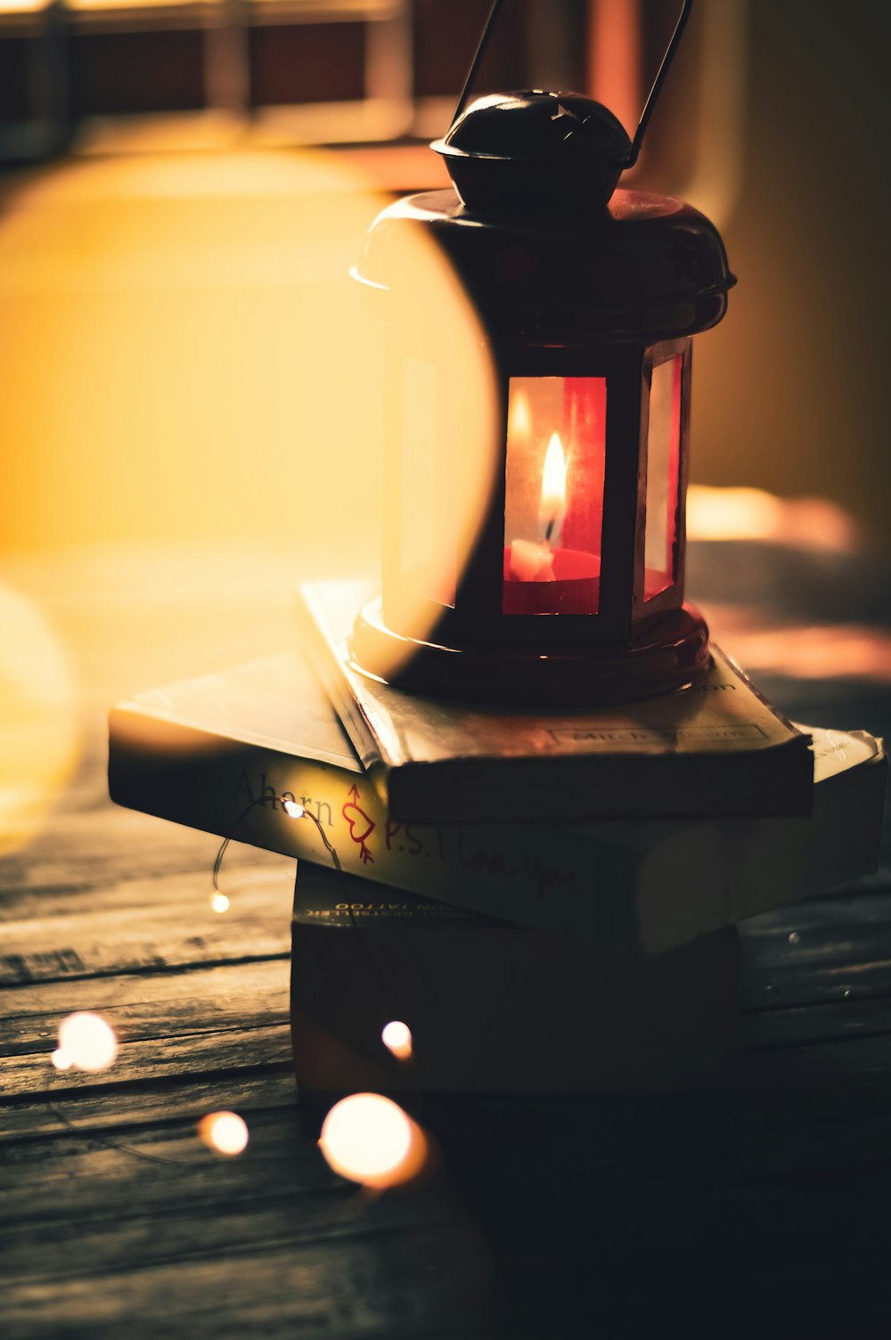 lighted tealight in black candle holder