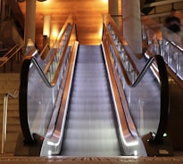 An escalator being maintained by professionals.