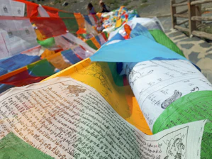 Close-up of colorful religious symbols intertwined with gender equality signs.