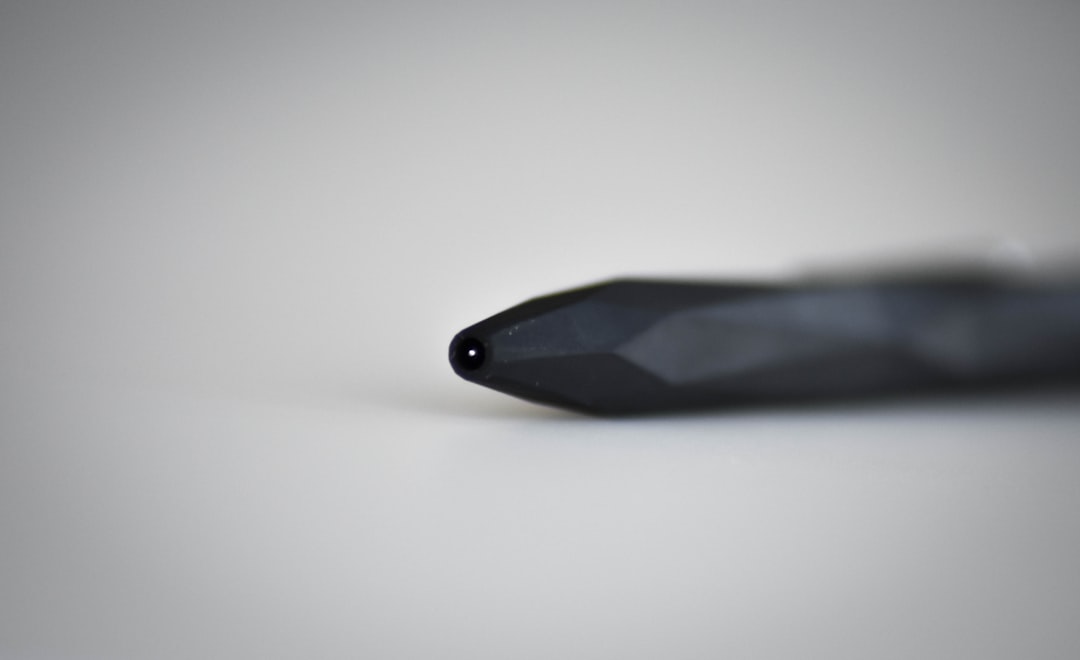 selective focus photography of black pen