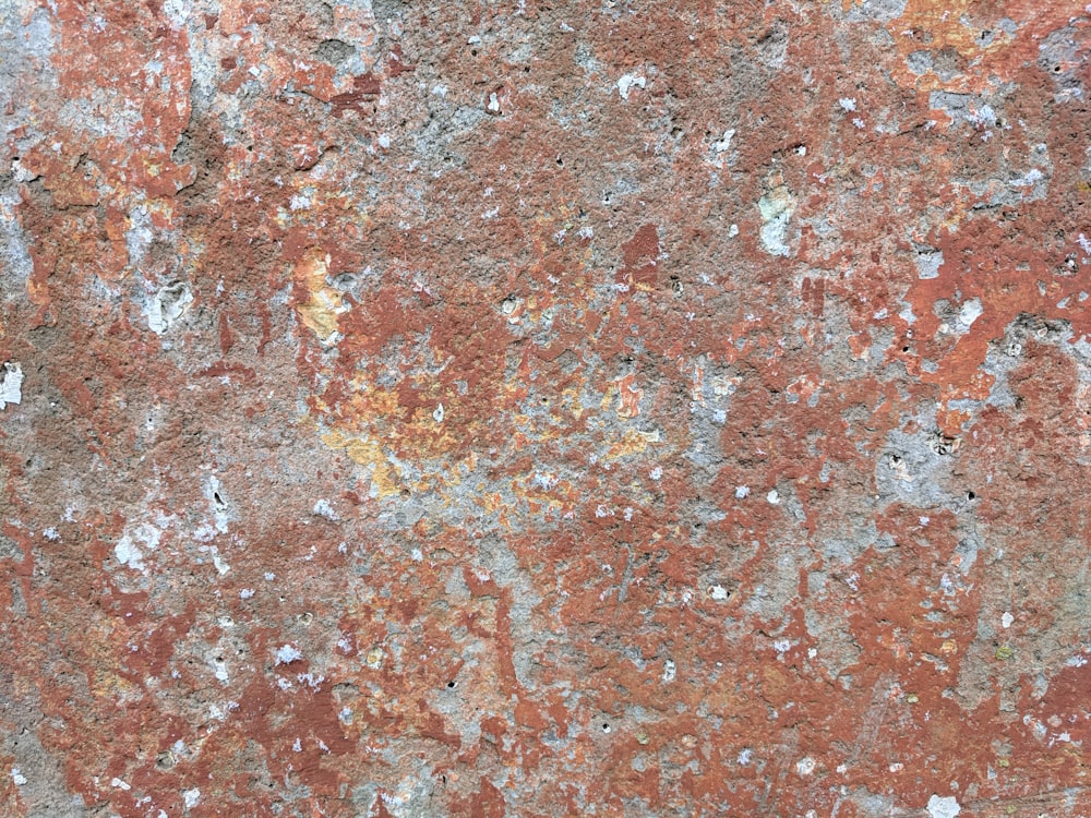 a close up of a red and white wall