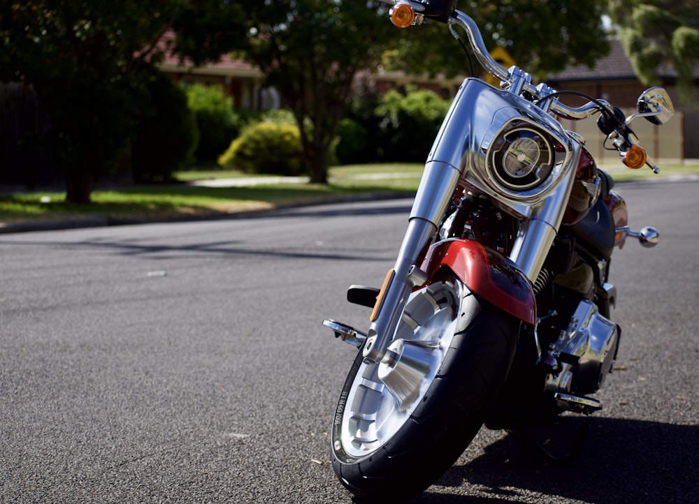 gray and red cruiser motorcycle on road