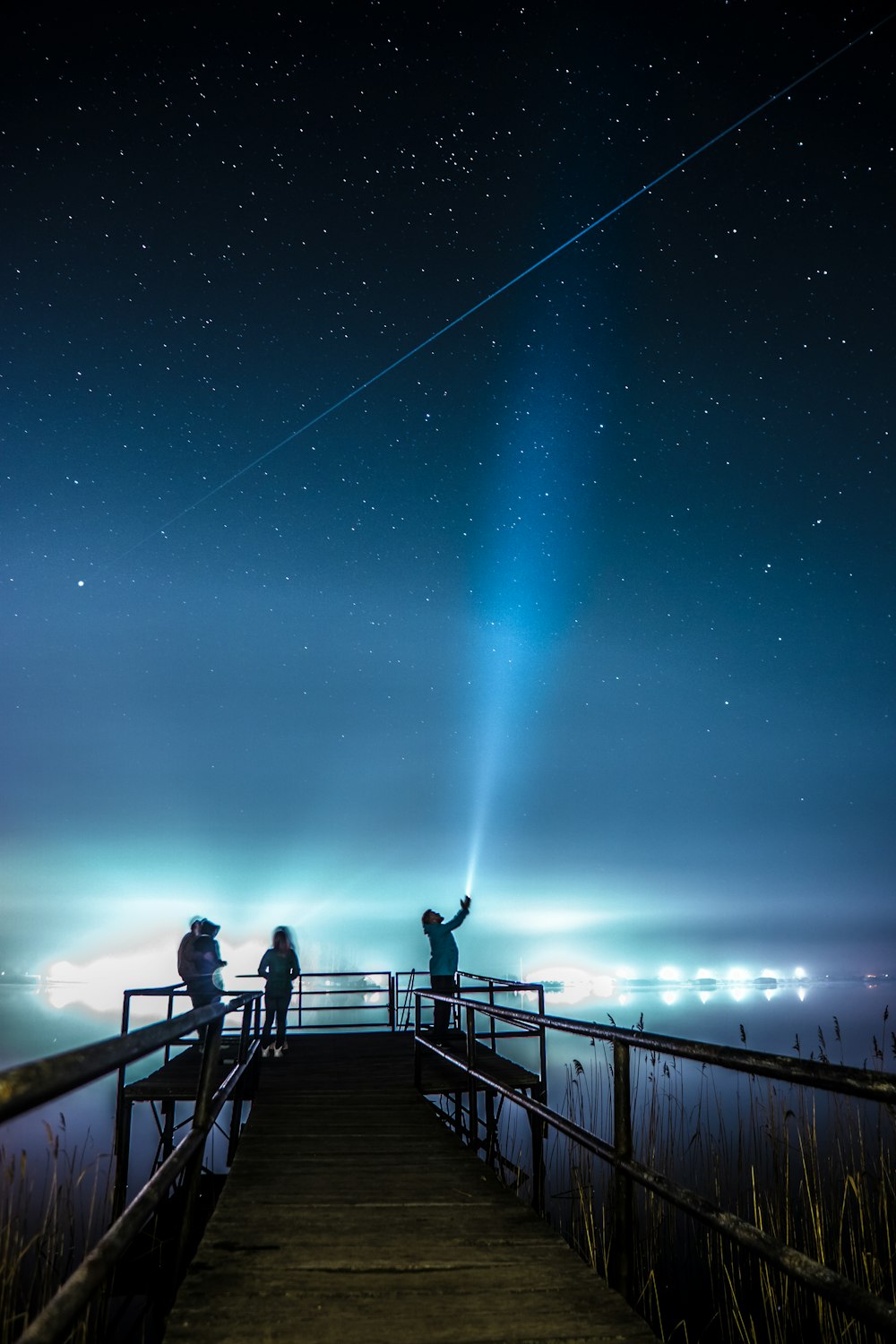 brown wooden pier under under blue sky