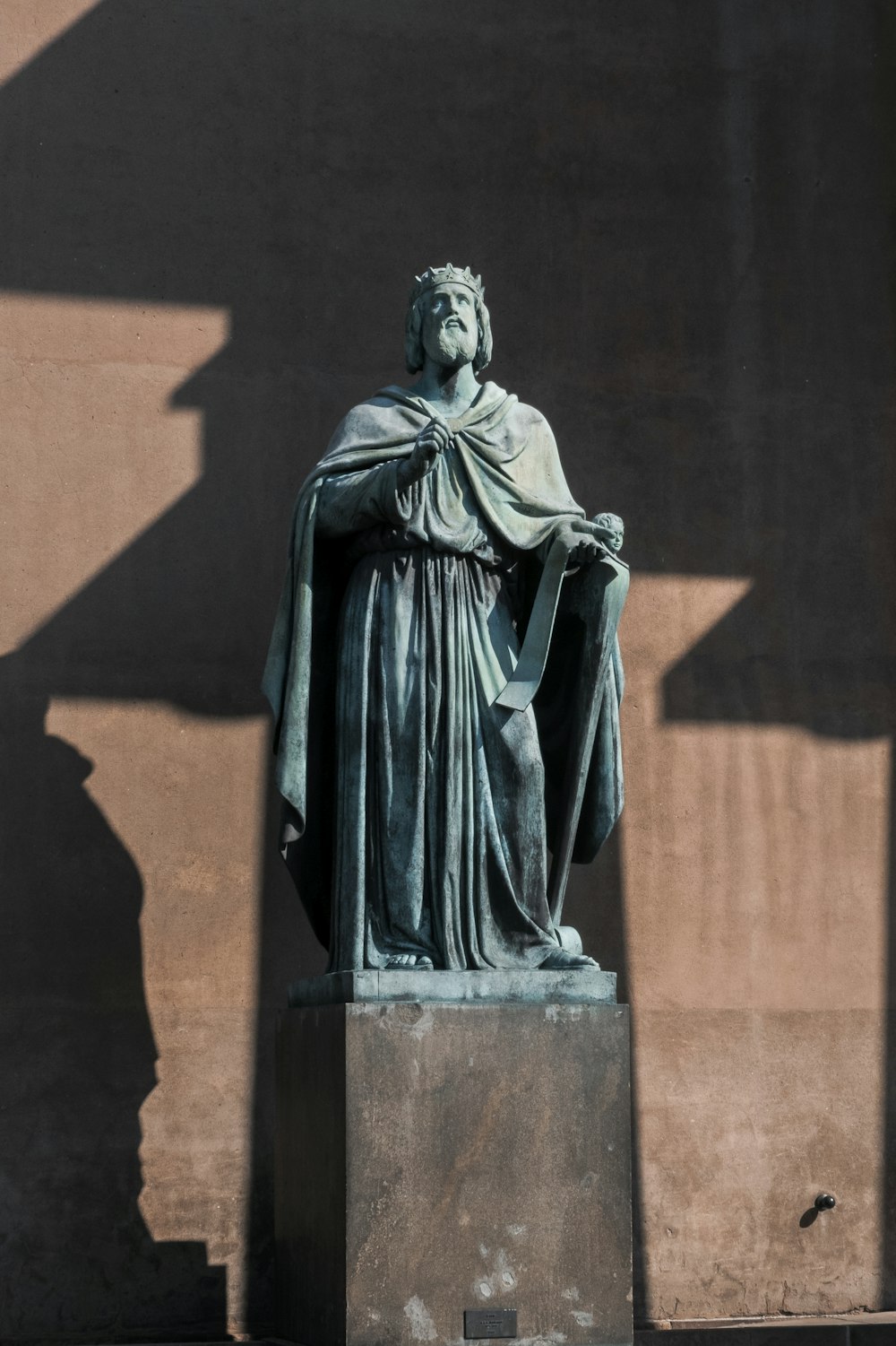 man wearing grey suit statue