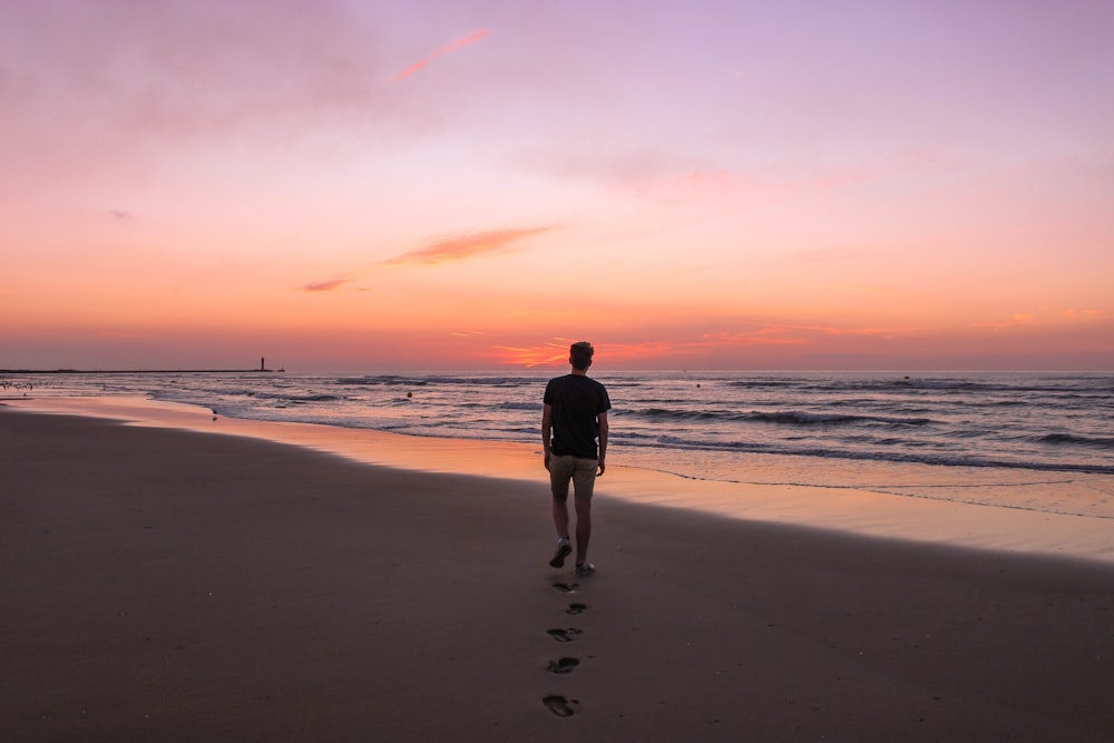 man walking on shore