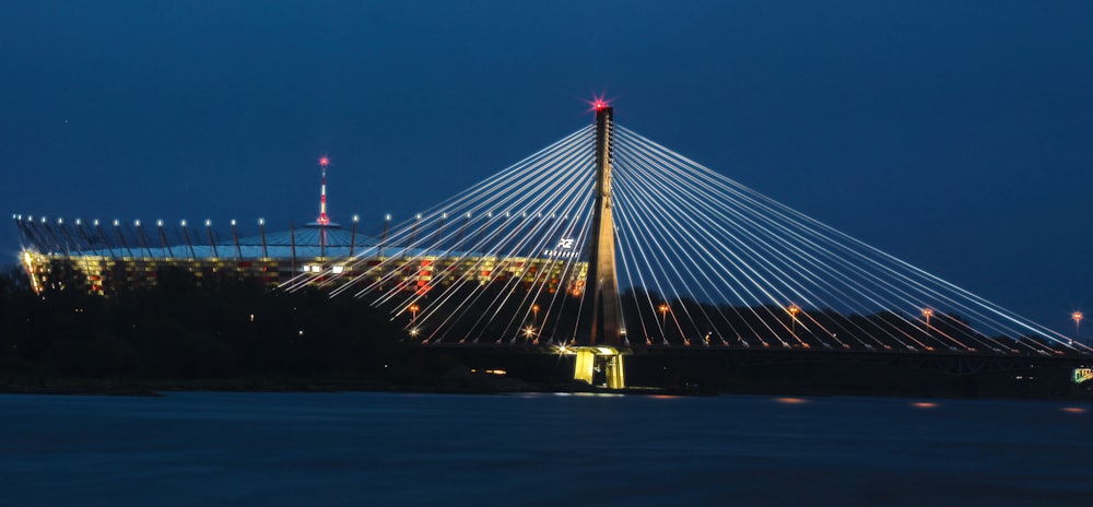 suspension bridge with lights at night