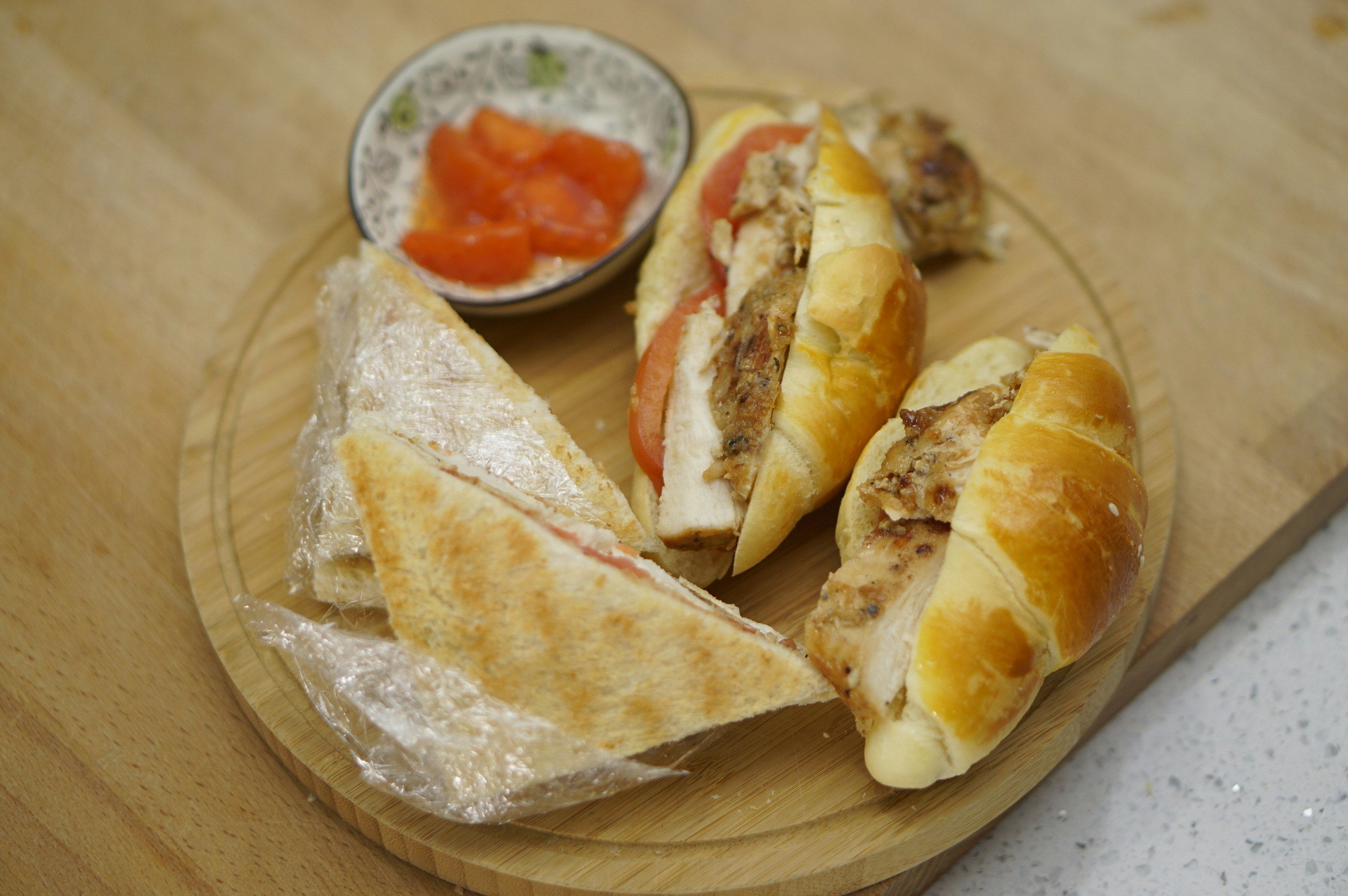 Filled bread rolls on a wooden board