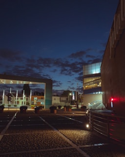 A serene urban scene captured at dusk with soft lighting and clean lines