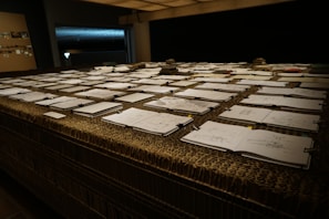 An array of colorful sketches and layouts on a table.
