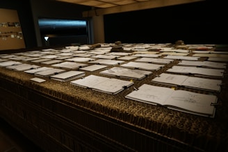 An array of colorful sketches and layouts on a table.